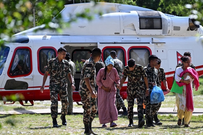 Nepal flash floods latest: Lake formed after landslide overflows as rescuers try to save 100 trapped in tunnel