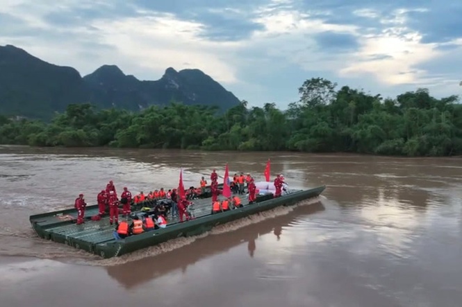 Motorised floating bridge deployed to pick up villagers stranded by flooding in southern China