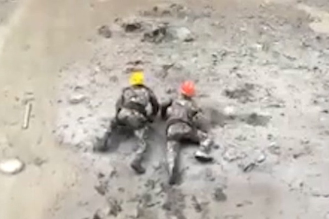 Nepal rescuers crawl through thick mud to save trapped hydropower workers