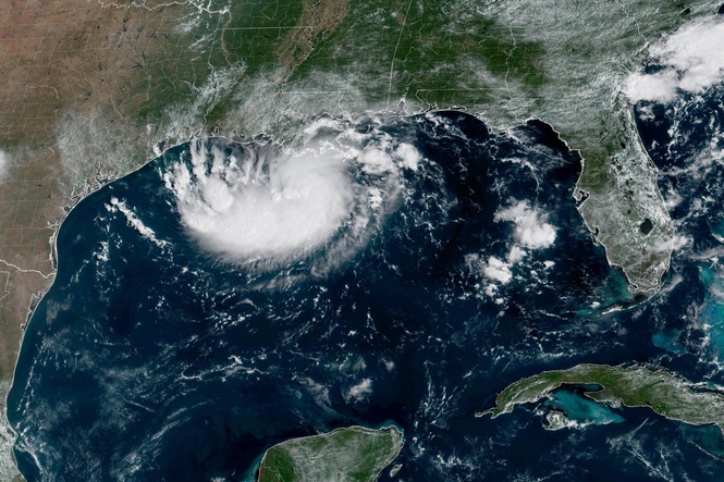 Tropical Storm Edouard heads for Texas and Louisiana while a storm moves toward Hawaii