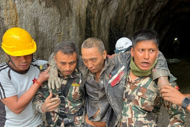Nepal’s rescuers pull out two more people alive from under debris 10 days after catastrophic floods