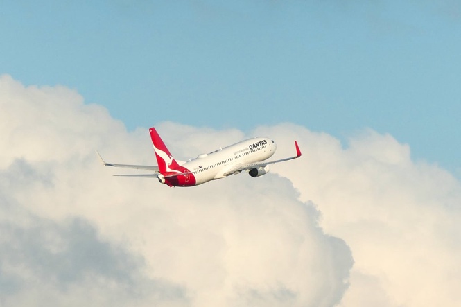 Qantas passengers describe panic as engine appears to emit fire mid-air