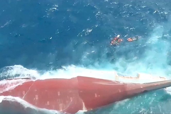 Over 100 people still missing as Indonesian rescuers battle choppy waters to board capsized passenger ship