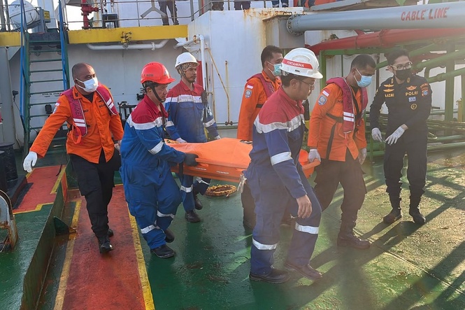 Rescuers search for nearly 130 missing people after ferry capsizes in Java Sea