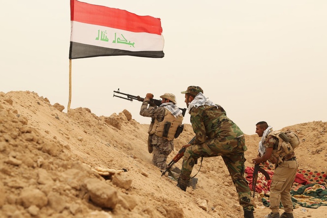 As the last US troops pack up in Iraq, militias signal their weapons will stay