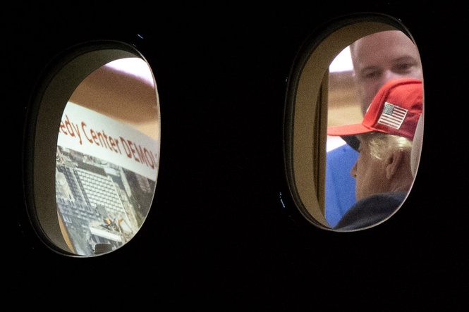 Trump seen reading ‘Kennedy Center DEMOLISHED’ poster aboard Air Force One