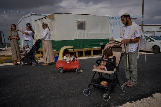 Photos show Israeli settlers celebrating settlement expansion in the occupied West Bank