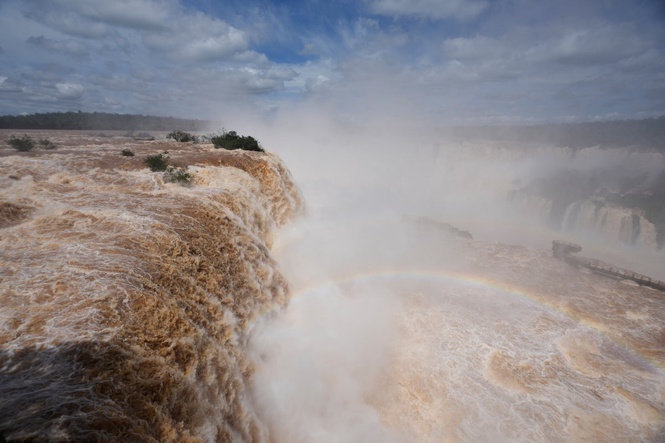 El Niño rains flood South America, sending residents fleeing and cattle swimming