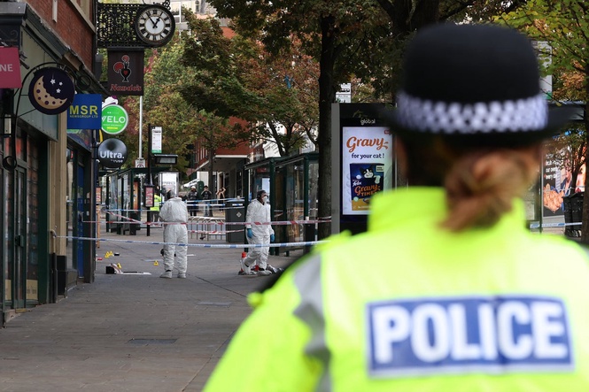 Hunt for man and woman after police officer injured in shooting
