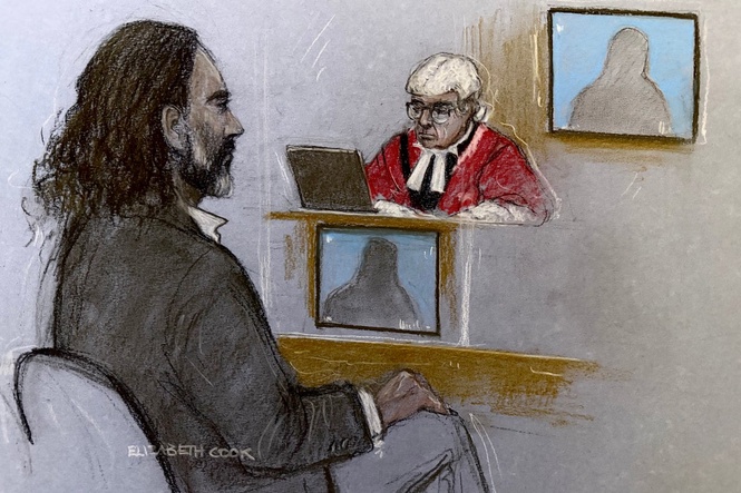 Russell Brand ‘pinned victim to wall and forcibly kissed her’, court hears