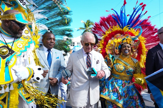 King Charles shakes maracas at Bahamas carnival parade amid slavery reparations protest