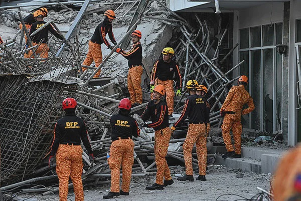 Image from: Rescuers race to find survivors after Philippines building collapse