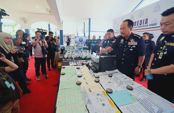 Image from: Sabah police cripple fake identity card ring, nine held