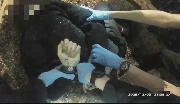Image from: UK police handcuff dying student after stabbing