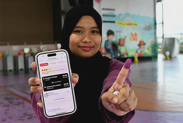 Image from: First-time voter travels 12 hours to cast ballot in Johor