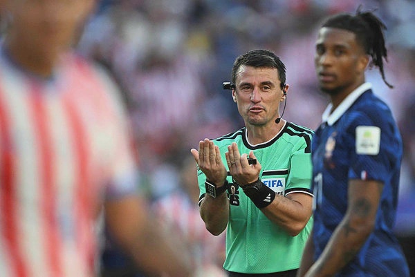 Image from: FIFA referee slammed after Paraguay escape bookings in fiery World Cup defeat