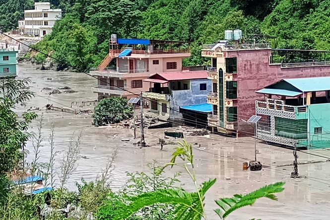 Image from: Nepal flash flood washes away villages, damages roads, power projects