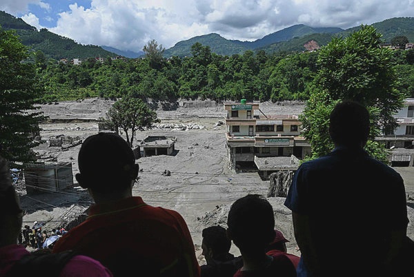 Image from: Desperate families search for missing after Nepal floods