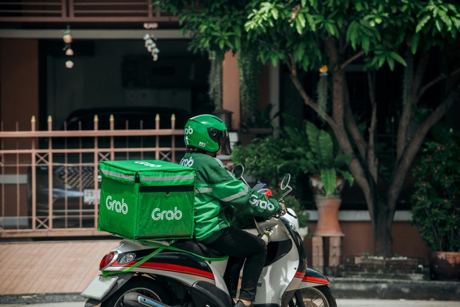 Image from: Grab lifts revenue, profit forecasts on AI, incentives
