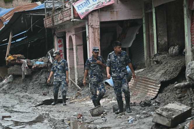 Image from: Rescuers pull survivors from debris as death toll mounts in Nepal flood disaster