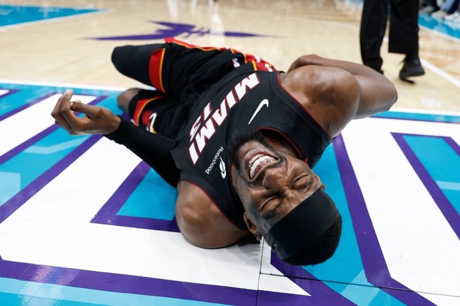 Bam Adebayo injured after LaMelo Ball trips him
