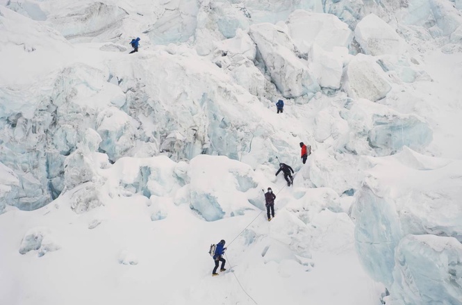 Photos show climbers attempting to scale Mount Everest despite increasing challenges