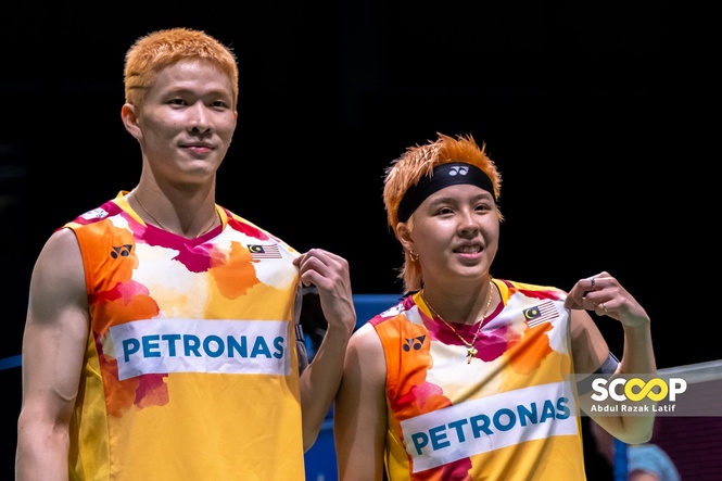 Image from: World champions Tang Jie-Ee Wei withdraw from title defence as ACL injury sidelines Ee Wei